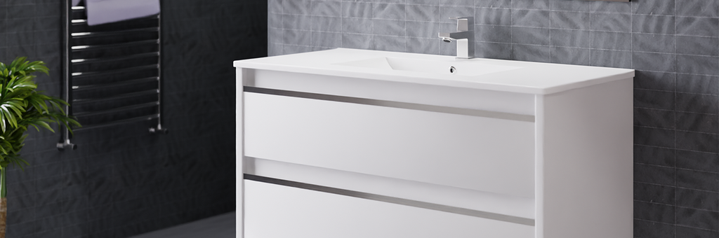 A 3 drawer, white vanity, with a polished chrome bathroom faucet on top of it. Emory & Bond has a wide range of high quality, luxurious bathroom vanities fit for any budget.